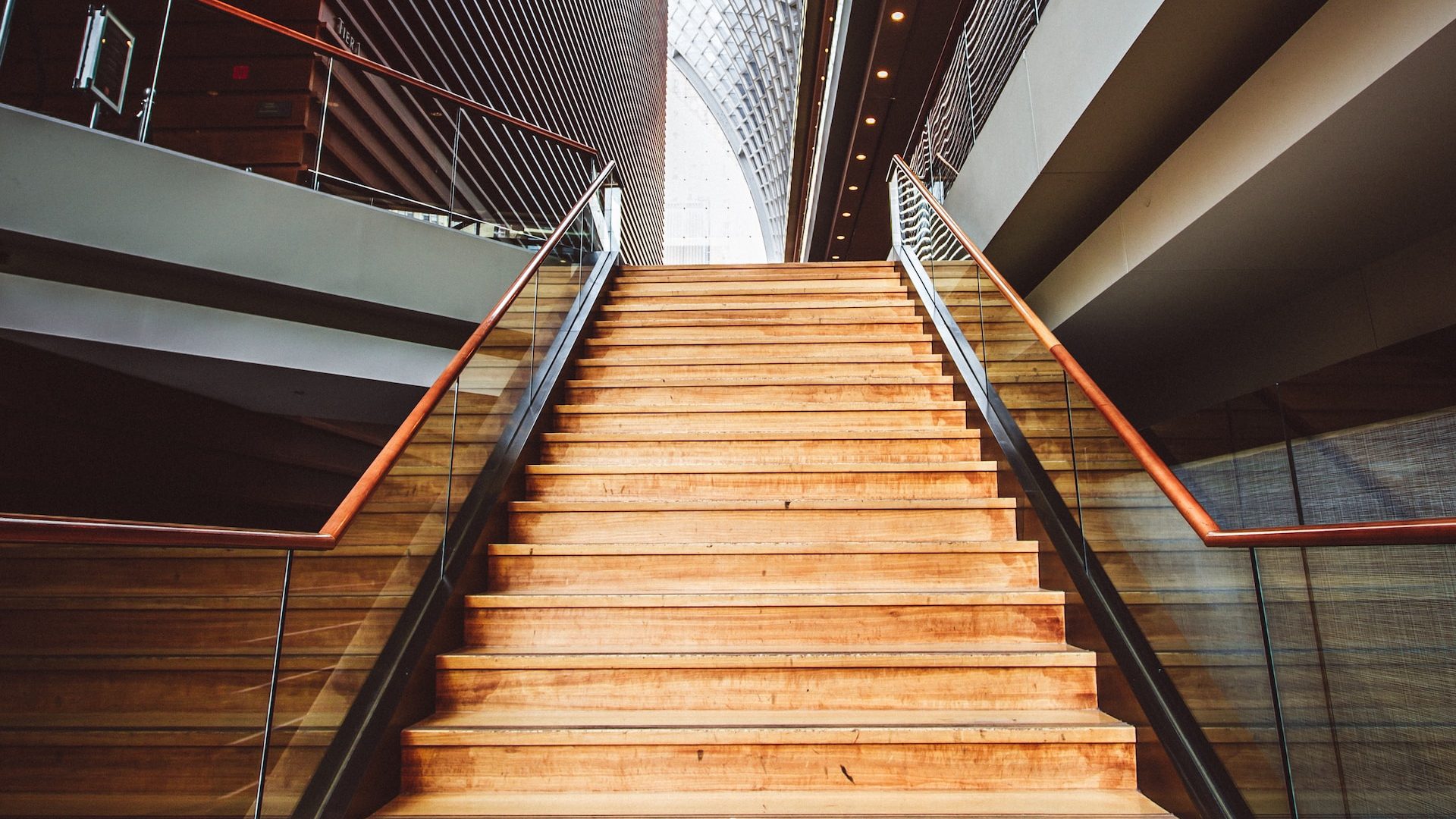 a stair case with wooden steps leading up to a second floor